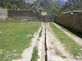 Image of the cracked schoolyard due to damage of the drainage system
